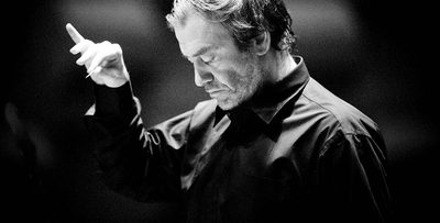 A black and white image of Valery Gergiev conducting