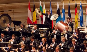 Large orchestra performing with instruments