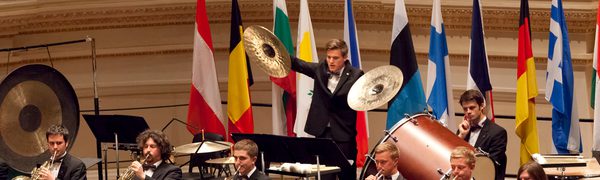 Large orchestra performing with instruments