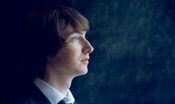 Man with Dark Hair looking off camera
