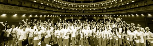 a group of young musicians stand together