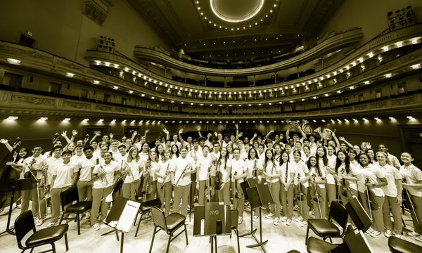 a group of young musicians stand together