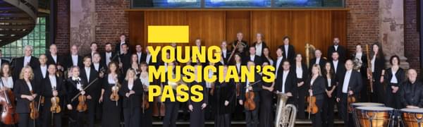 A yellow logo reading Young Musician's Pass overlays the orchestra standing posed with their instruments in a large room with big windows.