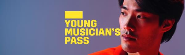 A yellow logo reading Young Musician's Pass overlays a man in a suit looking off to one side, he is bathed in red light