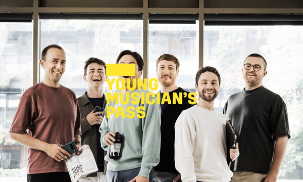 A yellow logo reading Young Musician's Pass overlays six singers standing facing the camera dressed in casual clothes