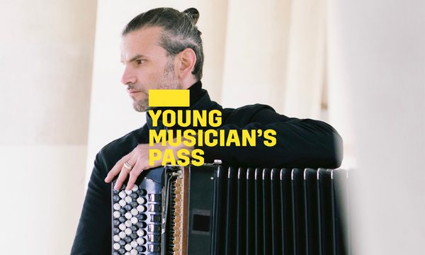 A yellow logo reading Young Musician's Pass overlays a serious looking man facing left holding a black accordion.