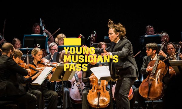 A yellow logo reading Young Musician's Pass overlays a conductor who waves his arms enthusiastically before an orchestra