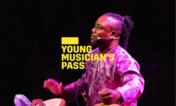 A yellow logo reading Young Musician's Pass overlays a man seated on stage, illuminated by purple light, playing two percussion instruments