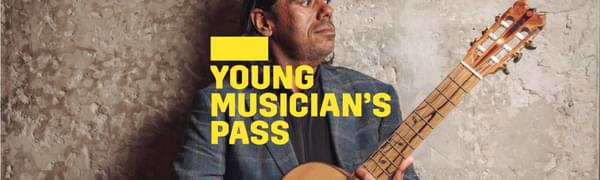 A yellow logo reading Young Musician's Pass overlays a man standing in front of a stone wall holding a guitar and looking to the side.