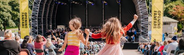 two girls dance holding hands