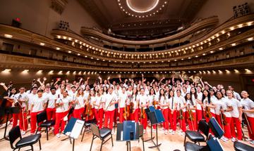 a group of young musicians stand together