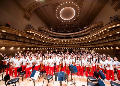 a group of young musicians stand together