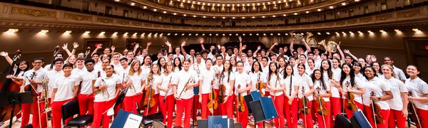 a group of young musicians stand together