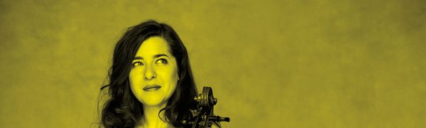 A black and yellow image of Alisa Weilerstein holding a cello and looking away from the camera