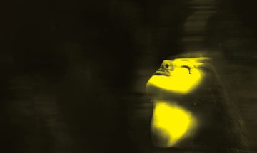 A black and yellow blurred image of a woman with her head tilted back