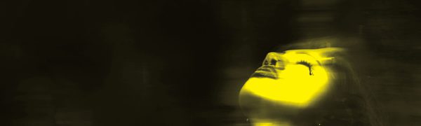 A black and yellow blurred image of a woman with her head tilted back