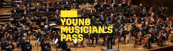 A yellow Young Musicians Pass logo in front of the Berlin Philharmoniker performing on stage