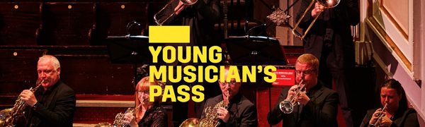 A yellow Young Musician's Pass logo in front of a group of brass musicians stand on stage