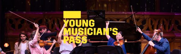A yellow Young Musician's Pass logo in front of a group of string musicians on stage, holding their bows in the air