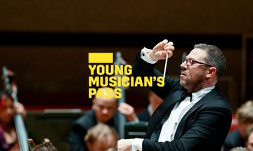 A yellow Young Musician's Pass logo in front of a conductor standing in front of an orchestra, conducting their performance