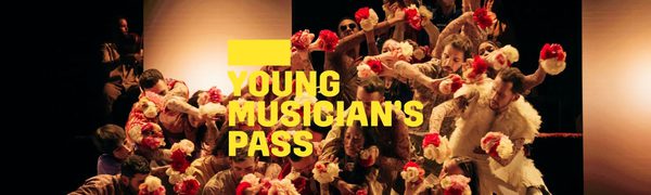 A yellow Young Musician's Pass logo in front of a large ensemble of dancers move as one while tightly packed together and holding white and red flowers