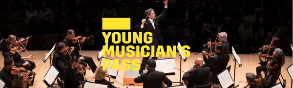 A yellow Young Musician's Pass logo in front of a conductor on stage facing the orchestra
