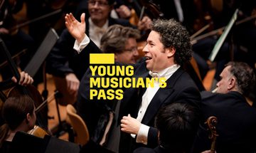 A yellow Young Musician's Pass logo in front of a conductor standing with one arm raised and a smile surrounded by orchestra members
