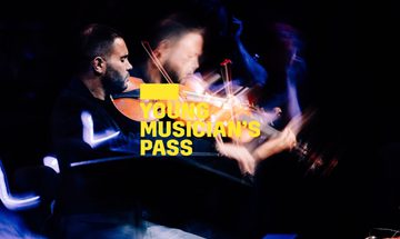 A yellow Young Musician's Pass logo in front of a man playing the viola d’amore in a dark room