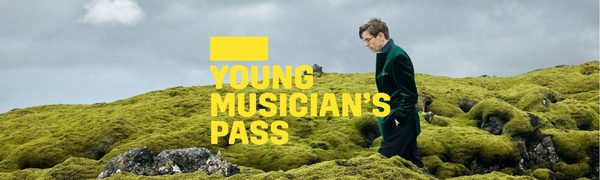 A yellow Young Musician's Pass logo in front of a man in a green jacket walking across a mossy hill