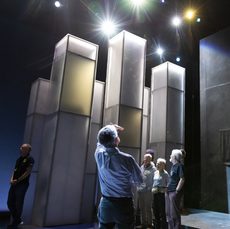 An image of people looking up at a stage set up