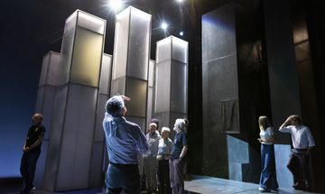 An image of people looking up at a stage set up