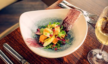 An image of a bowl of food sitting on a table
