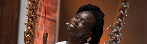 a women sings with her eyes closed