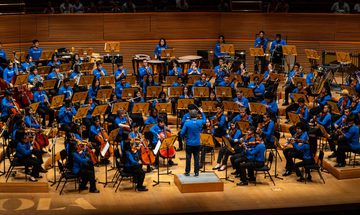 A zoomed out view of YOLA performing on stage