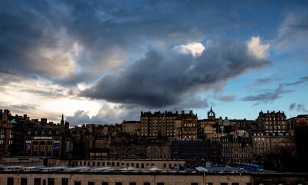 Edinburgh skyline against a blue sky with clouds