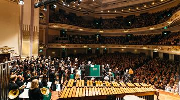 Orchestra looking out into the packed auditorium of Edinburgh’s Usher Hall