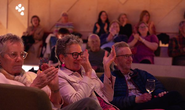 people applaud smiling