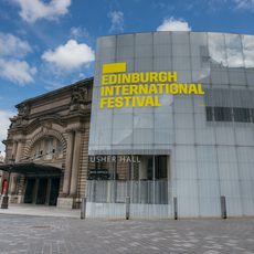 The exterior of the Usher Hall with 'Edinburgh International Festival' signage in yellow