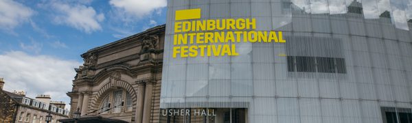 The exterior of the Usher Hall with 'Edinburgh International Festival' signage in yellow