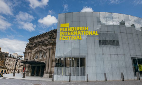The exterior of the Usher Hall with 'Edinburgh International Festival' signage in yellow