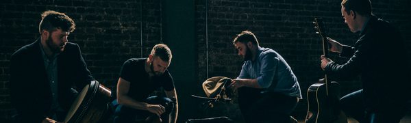 The four band members of RURA pick up their instruments from their cases