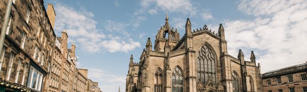 A fisheye view of the Royal Mile, including the St Giles Cathedral, a large Gothic church