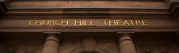 The front of Church Hill Theatre, a pink sandstone building with columns
