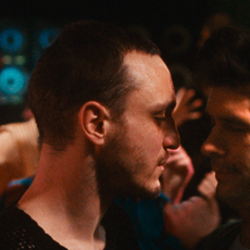 Franz Rogowski (Tomas) and Ben Whishaw (Martin) about to share a kiss in Passages.