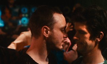 Franz Rogowski (Tomas) and Ben Whishaw (Martin) about to share a kiss in Passages.