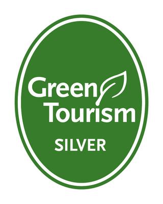 A green oval with the words 'Green Tourism Silver' inside it in white