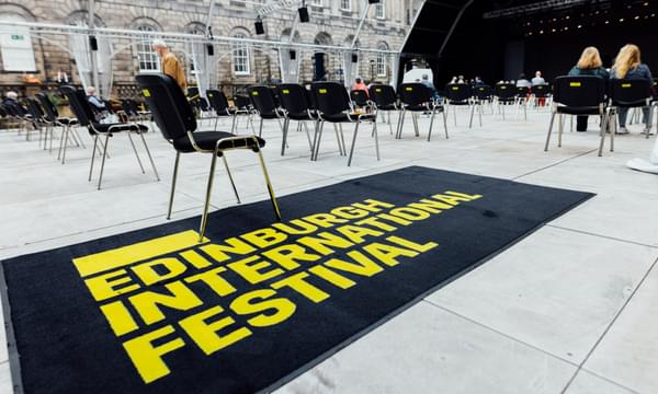 A welcome mat reads 'Edinburgh International Festival' at the entrance to the Old College Quad venue.